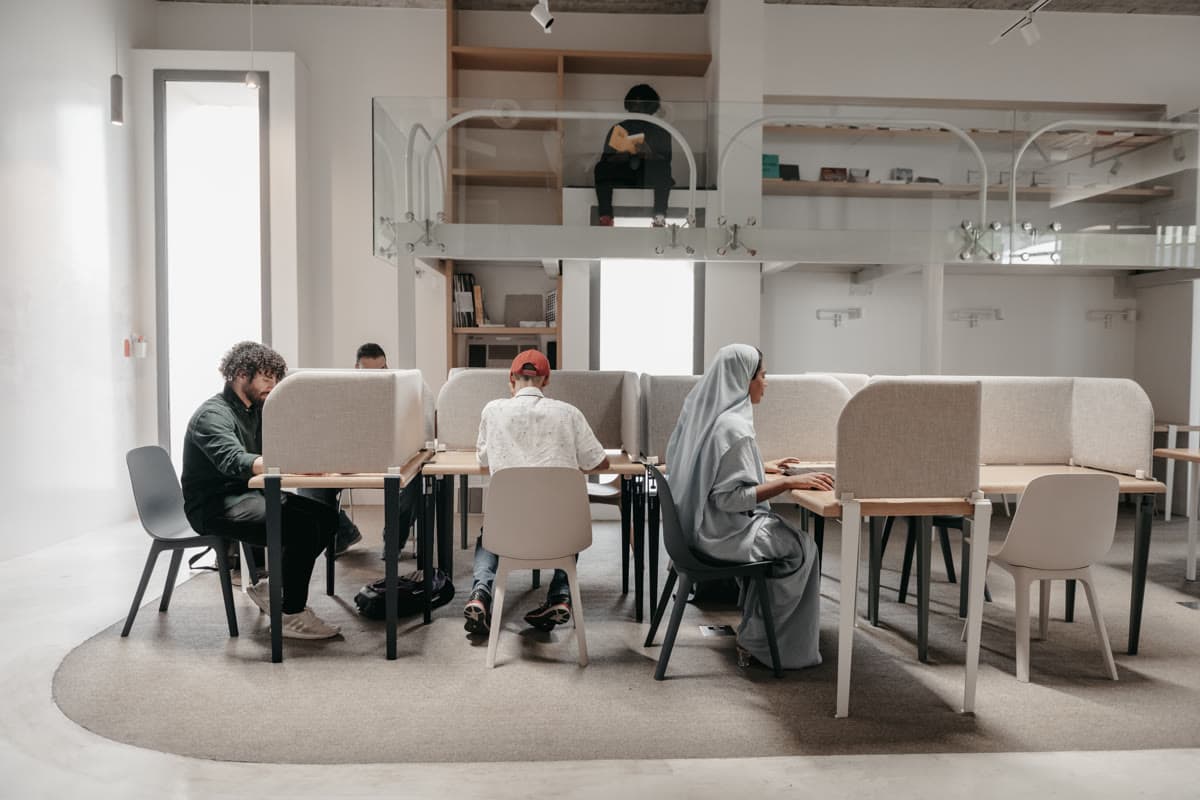 Working at an open desk in the MAZJ shared workspace in Al-Khobar